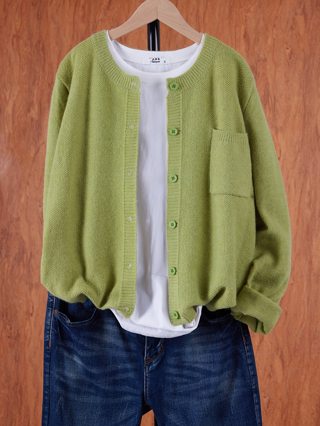 Wren relaxed button-front cardigan in greenish yellow, front view on hanger
