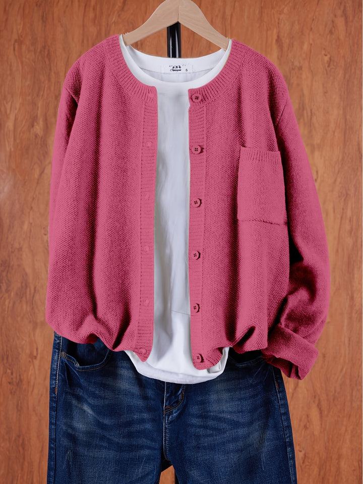 Wren relaxed button-front cardigan in dark pink, front view on hanger